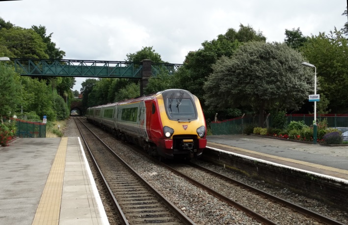 A Virgin Voyager diverted from the West Coast Main Line  passes Frodsham on 2 Aug 2015